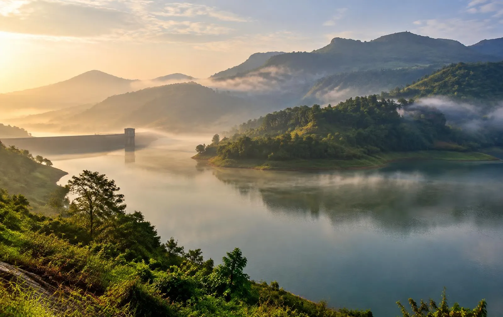 Misty backwaters of Temghar Dam surrounded by green Sahyadri hills